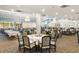 Large dining room set with tables and chairs and elegant chandeliers at 1800 Clairmont Lk # 216, Decatur, GA 30033