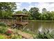 Charming gazebo on a pier overlooking a serene pond, surrounded by colorful flower gardens at 1800 Clairmont Lk # 216, Decatur, GA 30033
