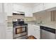 Updated kitchen featuring stainless steel appliances, granite countertops, and white cabinets at 1800 Clairmont Lk # 216, Decatur, GA 30033