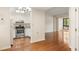 Open concept living space with kitchen featuring stainless appliances, granite counters and white cabinets at 1800 Clairmont Lk # 216, Decatur, GA 30033