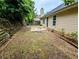View of the backyard with a patio area, offering a private outdoor space for relaxation and entertainment at 225 Kentshire Pl, Lawrenceville, GA 30044