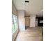 Cozy dining area with modern pendant lighting, next to the kitchen and backyard view at 225 Kentshire Pl, Lawrenceville, GA 30044