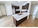 Modern kitchen featuring a center island, stainless steel appliances, and stylish countertops at 225 Kentshire Pl, Lawrenceville, GA 30044