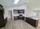 Well-equipped kitchen with ample cabinet space, stainless steel appliances, and updated flooring at 225 Kentshire Pl, Lawrenceville, GA 30044