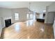 Open-concept living area with hardwood floors, fireplace, and seamless flow to the kitchen at 225 Kentshire Pl, Lawrenceville, GA 30044