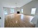Spacious living room with hardwood floors, a fireplace, and abundant natural light at 225 Kentshire Pl, Lawrenceville, GA 30044