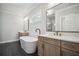 Bathroom featuring double vanities, a bathtub, and neutral color palette at 591 Brashy St, Woodstock, GA 30188