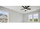 Bedroom featuring a ceiling fan and two windows for lots of natural light at 591 Brashy St, Woodstock, GA 30188