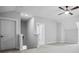 Upstairs bonus room with light neutral carpet and a ceiling fan at 591 Brashy St, Woodstock, GA 30188