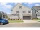Charming home with neutral siding, inviting curb appeal, two-car garage and well-maintained landscaping at 591 Brashy St, Woodstock, GA 30188