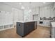 Well-appointed kitchen with a center island, stainless steel appliances, and ample storage at 591 Brashy St, Woodstock, GA 30188