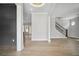 Bright and airy living room with hardwood floors and a modern staircase at 591 Brashy St, Woodstock, GA 30188
