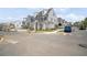 Street view featuring a gray home with white trim and a well-maintained lawn at 591 Brashy St, Woodstock, GA 30188