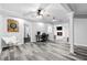 Finished basement with hardwood floors, and an open layout with an office space and fireplace at 75 Auburn Rd, Auburn, GA 30011