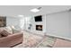 Cozy basement living space with a fireplace and TV, perfect for relaxing and entertaining guests at 75 Auburn Rd, Auburn, GA 30011