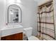 Bright bathroom with a vanity, commode and shower with colorful shower curtain at 75 Auburn Rd, Auburn, GA 30011
