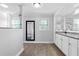 Luxurious bathroom with dual sinks, granite countertop, and a glass-enclosed shower for a spa-like experience at 75 Auburn Rd, Auburn, GA 30011