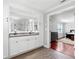 Luxurious bathroom with dual sinks, granite countertop, and view to main bedroom at 75 Auburn Rd, Auburn, GA 30011