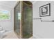 Modern bathroom showcasing a glass-enclosed tiled shower, providing a sleek and functional design at 75 Auburn Rd, Auburn, GA 30011