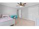 Cozy bedroom with ceiling fan and ample closet space at 75 Auburn Rd, Auburn, GA 30011
