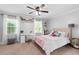 Charming bedroom featuring a ceiling fan, natural light from two windows and a cozy, inviting atmosphere at 75 Auburn Rd, Auburn, GA 30011