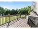 Wooden deck with a view of the backyard, perfect for outdoor relaxation and enjoyment at 75 Auburn Rd, Auburn, GA 30011