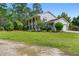 Attractive two-story home with a covered porch and a side-entry garage nestled on a spacious lot at 75 Auburn Rd, Auburn, GA 30011
