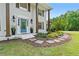 Beautiful home featuring a stone walkway, manicured landscaping, and classic architectural details at 75 Auburn Rd, Auburn, GA 30011