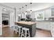 Stylish kitchen featuring white cabinetry, a butcher block island, and stainless steel appliances at 75 Auburn Rd, Auburn, GA 30011