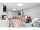 Cozy living room with plush seating, stylish rug, and a flatscreen TV for relaxed entertainment at 75 Auburn Rd, Auburn, GA 30011