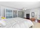 Spacious main bedroom with closet, ceiling fan, and comfortable bed for restful nights at 75 Auburn Rd, Auburn, GA 30011