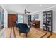 Bright sitting area features hardwood floors, built-in bookshelves, and comfortable seating at 75 Auburn Rd, Auburn, GA 30011