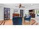 Cozy sitting area with hardwood floors, bookshelves, and comfortable armchairs at 75 Auburn Rd, Auburn, GA 30011
