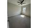 Bedroom with carpet, ceiling fan, a window that lets in natural light and a white door at 861 Pineberry Ct, Grayson, GA 30017