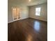 Spacious bonus room with hardwood floors, ample natural light, and flexible space for various activities at 861 Pineberry Ct, Grayson, GA 30017