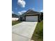 Charming single-story home with a stone and siding exterior, large garage, and well-maintained lawn at 861 Pineberry Ct, Grayson, GA 30017