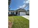 Beautiful single-story home with stone accents, a two-car garage, and a well-manicured front lawn at 861 Pineberry Ct, Grayson, GA 30017