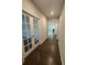 Inviting hallway with hardwood floors, leading to a bright living space with a fireplace, and a clear view throughout at 861 Pineberry Ct, Grayson, GA 30017