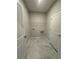 Bright laundry room features white marble tile floor, ample shelving and convenient utility connections at 861 Pineberry Ct, Grayson, GA 30017