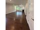 Spacious living room with hardwood floors, neutral walls, and a cozy fireplace at 861 Pineberry Ct, Grayson, GA 30017