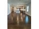 Open concept living area with kitchen, hardwood flooring, and natural light, great for entertaining at 861 Pineberry Ct, Grayson, GA 30017
