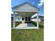 Spacious covered patio perfect for outdoor entertaining with concrete flooring and stylish design at 861 Pineberry Ct, Grayson, GA 30017