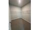 Empty walk-in closet with carpet and wire shelving, offering ample storage space at 861 Pineberry Ct, Grayson, GA 30017