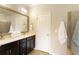 Bright bathroom with a double sink vanity, large mirror, and walk-in shower at 1365 Hawthorne Se Ave, Smyrna, GA 30080