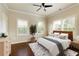 Bedroom with large windows, a ceiling fan, and stylish decor at 1365 Hawthorne Se Ave, Smyrna, GA 30080