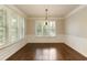 Dining room featuring white trim, chair rails, dark hardwood flooring, and plantation shutters at 1365 Hawthorne Se Ave, Smyrna, GA 30080