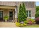 Close-up of the home's entrance with a well-manicured garden, creating a welcoming and appealing first impression at 1365 Hawthorne Se Ave, Smyrna, GA 30080