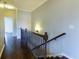 Upstairs hallway featuring hardwood floors, a decorative railing and soft neutral paint at 1365 Hawthorne Se Ave, Smyrna, GA 30080
