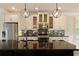 Well-equipped kitchen featuring a center island, sleek countertops, and pendant lighting, blending style and functionality at 1365 Hawthorne Se Ave, Smyrna, GA 30080