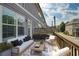 Outdoor patio featuring a seating area with a sofa, chairs, coffee table, and decorative rug at 1365 Hawthorne Se Ave, Smyrna, GA 30080